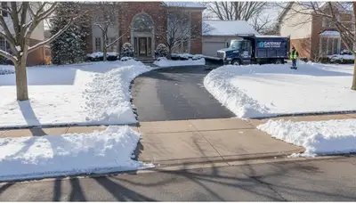 Cleared driveway after professional snow removal by Chop Chop Landscaping in St Louis, MO
