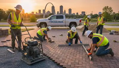 Crew installing driveway pavers in St Louis, MO during professional landscaping project